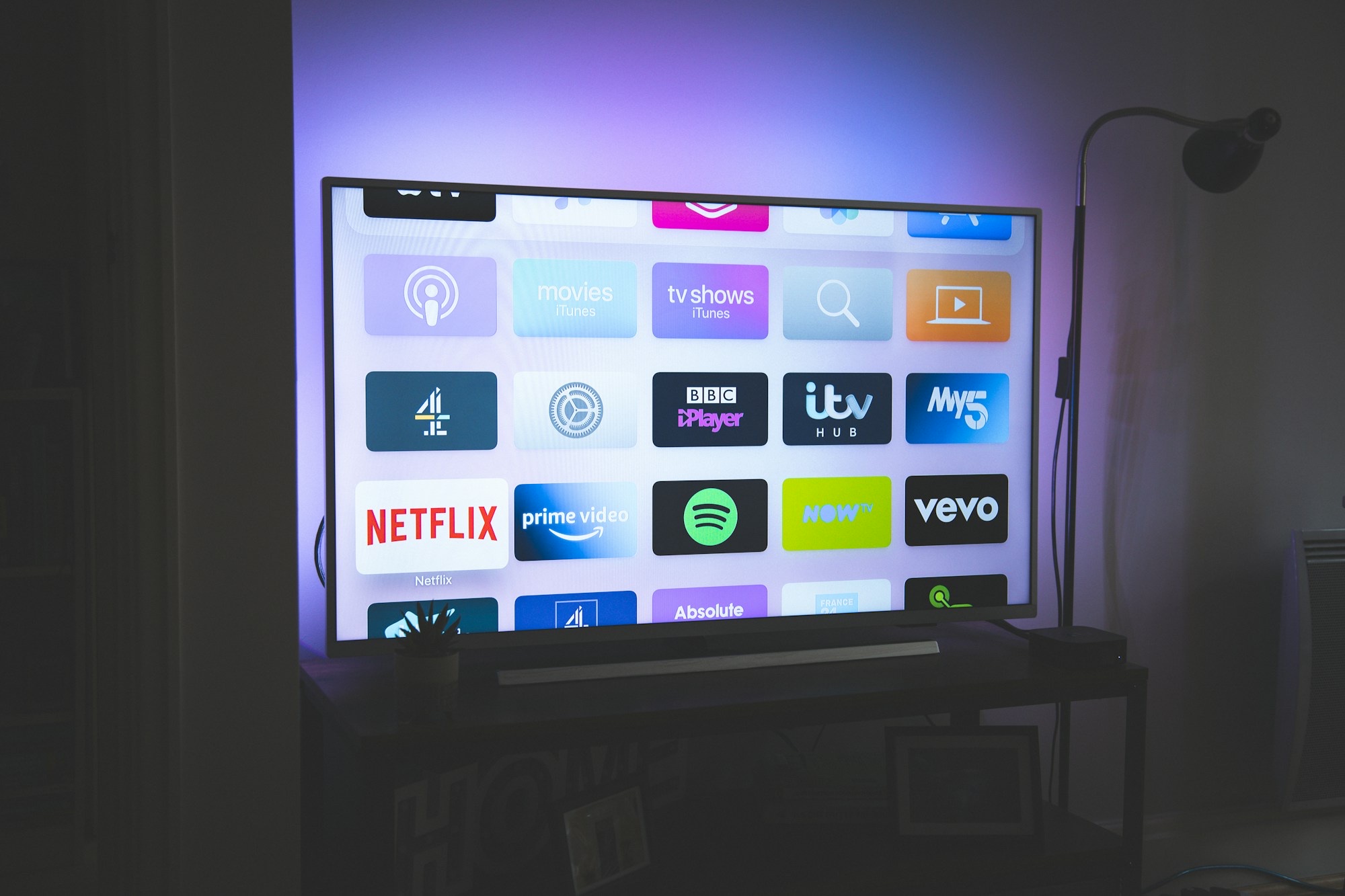 Smart TV with ambient bias lighting — home entertainment setup